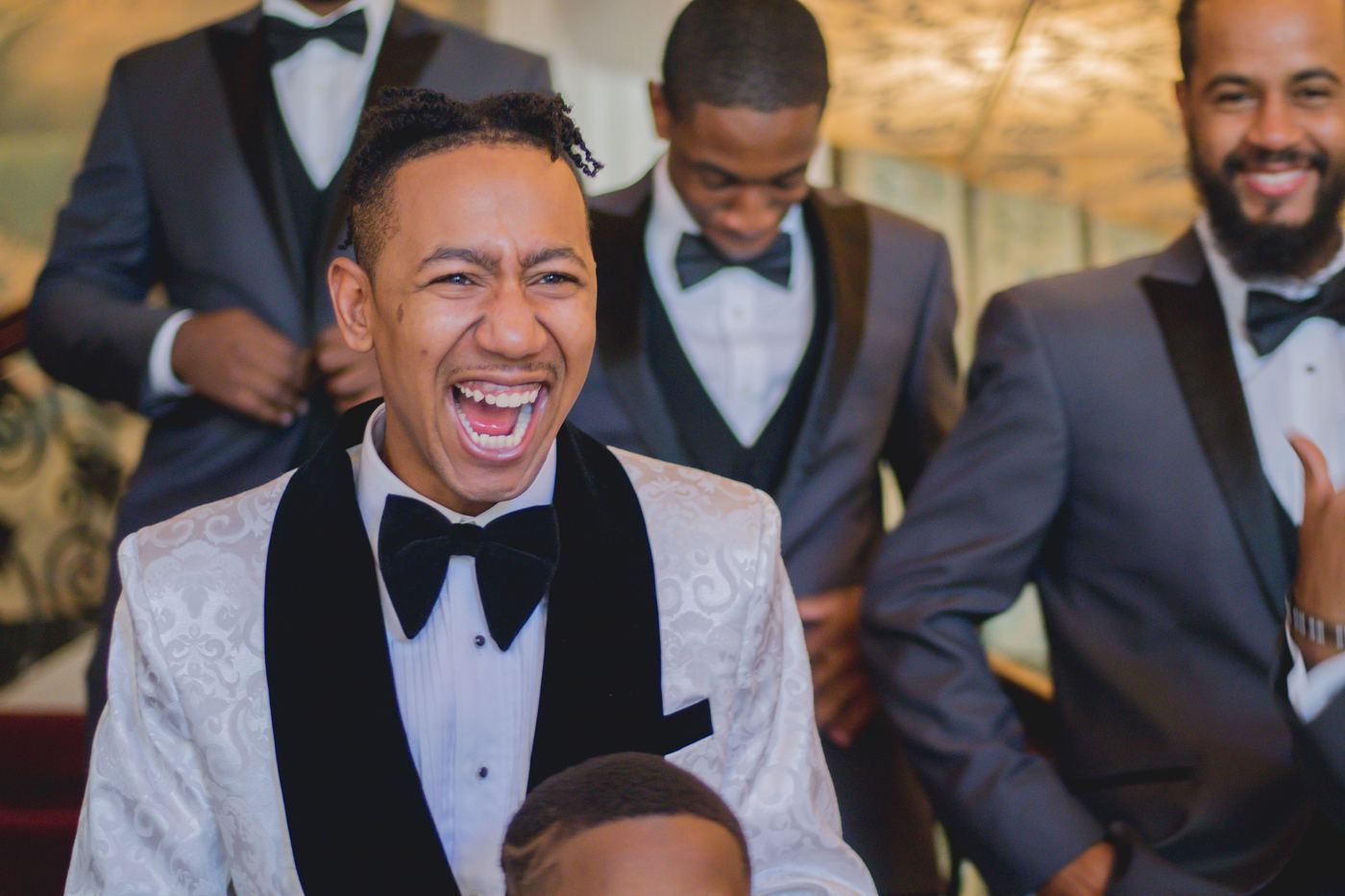 Pure joy: Candid laughter between the posed portraits.